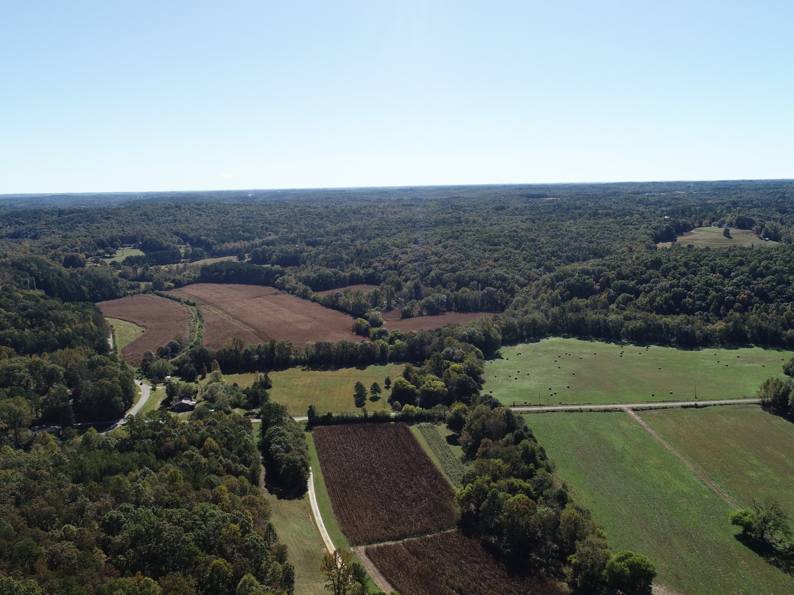 Aerial photo of partially forested farm
