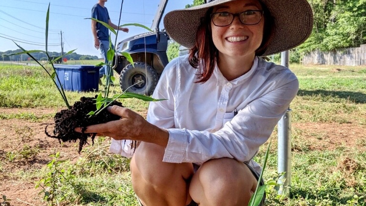 Noelle holding a ginger plant 
