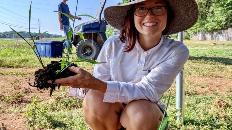 Noelle holding a ginger plant 